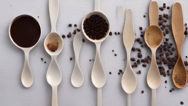 Coffee grind sizes from fine espresso grind to coarse French press grind on white spoons