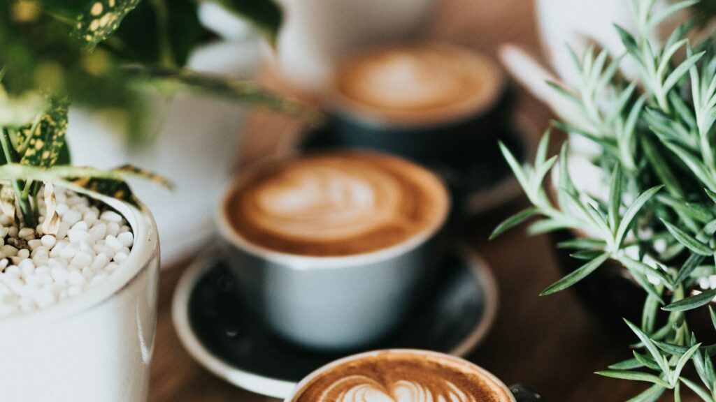 Coffee topped with whipped cream in a glass